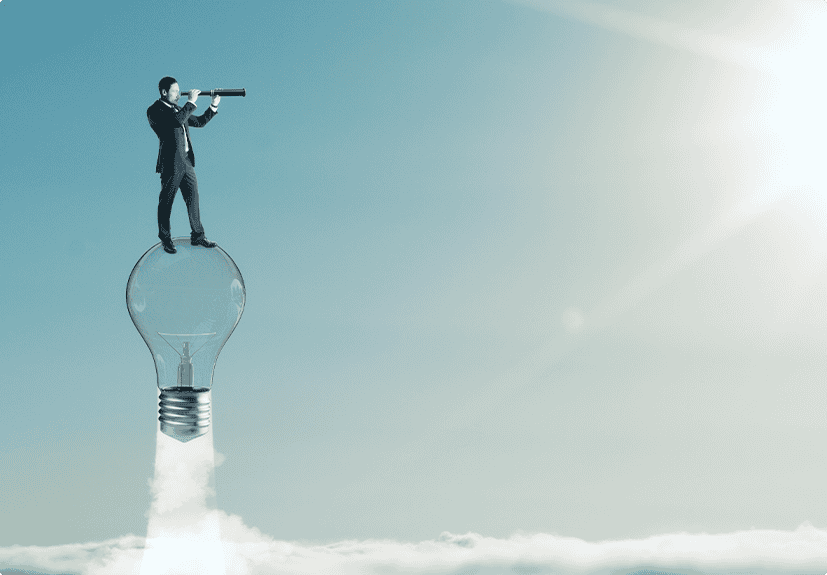 A man in a suit stands on top of a large lightbulb, which is flying above the clouds, while looking through a telescope toward the sky.