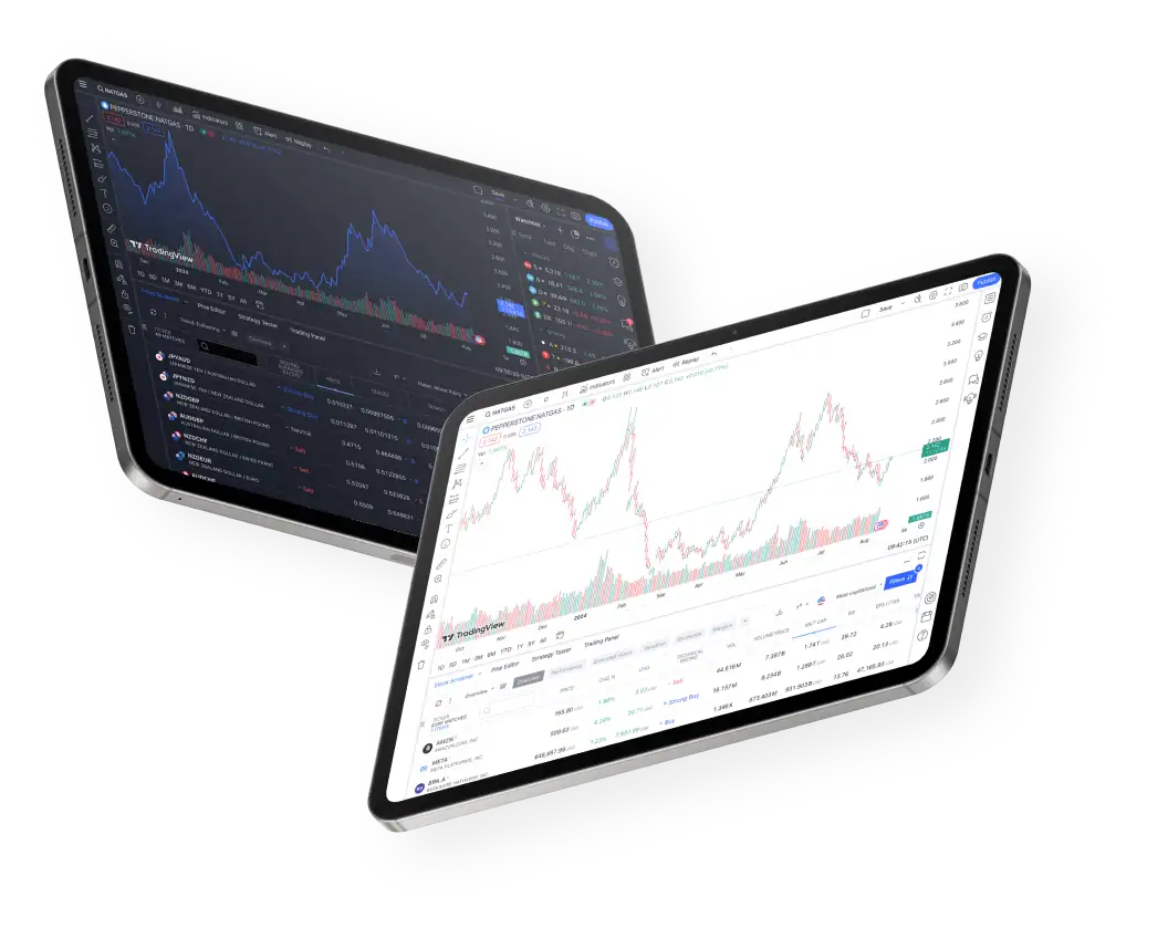 Two tablet devices displaying stock trading platforms with financial charts, price data, and market analysis tools visible on their screens during live sessions.